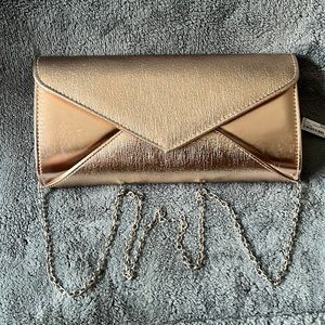 NWT - Charming Charlie’s RSVP Rose Gold  Clutch.